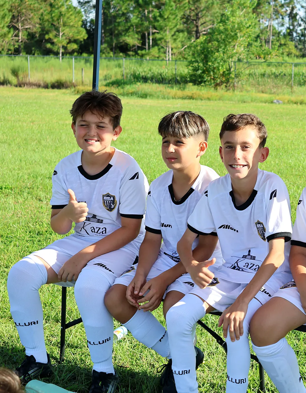 Galo players smiling on the bench